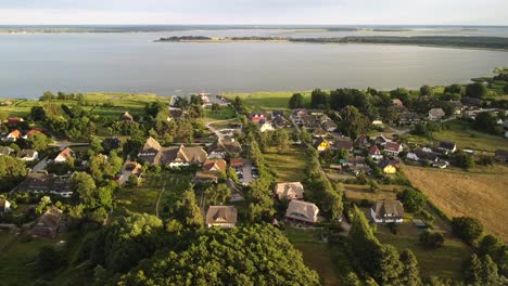 Aerial-View-From-Wieck-Village-On-The-Peninsula-Fischland-darß-zingst-In-Sunset-Light,-With-Bodden-In-Background