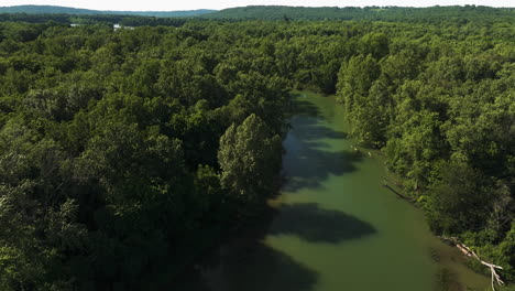 Aerial-View-Of-Rainforest-With-River-Flowing-Through-In-AR,-USA---drone-shot