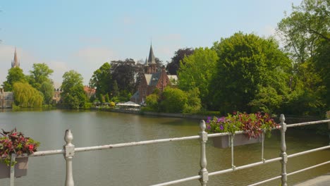 People-Sightseeing-At-The-Bridge-Over-Minnewater-In-Bruges,-Belgium
