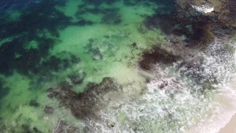 Bird’s-eye-view-of-the-tide-coming-in-at-Ocean-Reef,-Perth-in-Australia
