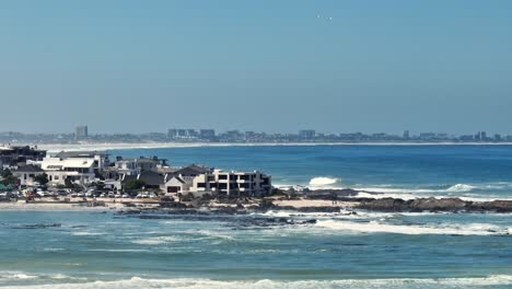 Long-lens-drone-shot-of-the-coast-line-near-Big-Bay,-Cape-Town