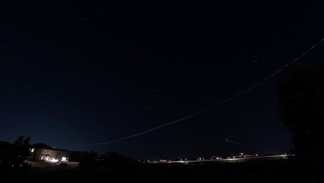 Jet-trails-cross-the-sky-in-a-busy-air-traffic-corridor-in-central-Utah---light-trails-time-lapse