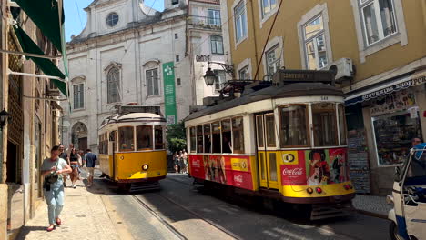 Close-up-shot-of-many-famous-yellow-tram-transporting-tourist-in-city-center-of-Lisbon