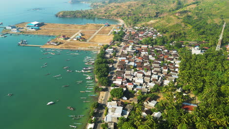 Aerial-over-the-fishing-harbour-and-town-of-Awang-Mertak-on-Lombok-island,-Indonesia