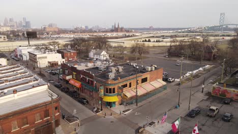 Mexican-Township-in-Detroit-with-Ambassador-bridge-in-background,-aerial-view