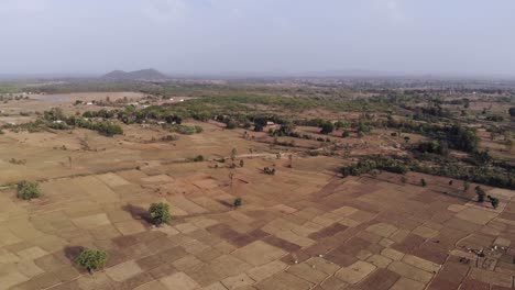 Aerial-view-of-Empty-field-before-plantation-or-after-harvesting-in-Jharkhand-village-Chatra,-India
