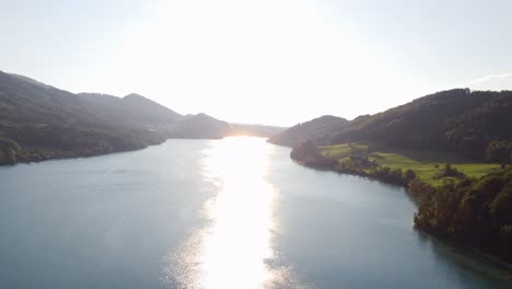 Sensational-aerial-shot-of-Austrian-lake-on-summer-day,-golden-hour,-Fuschl