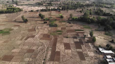 Aerial-view-of-empty-field-before-plantation-or-after-harvesting,-drone-view-of-the-farm-in-Jharkhand,-India