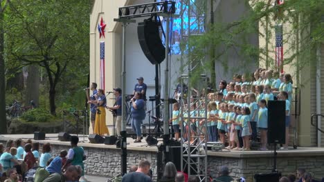 Beautiful-summer-day-in-a-park-with-a-children's-choir-performing-for-the-community