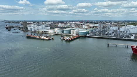 Aerial-panorama-view-of-industrial-harbor-with-dock-in-Bayonne-New-Jersey-with-pipes-and-tanks,-USA---Wide-shot