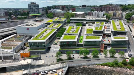 Aerial-birds-eye-shot-of-Old-Navy-Outlet-Center-with-green-growing-grass-on-rooftop-in-Staten-island,New-York-City