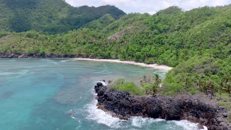 Aerial-orbit-shot-of-empty-Playa-Ermitano-with-beautiful-scenery-in-background---Coral-Reef-underwater-in-Samana,-Dominican-Republic