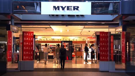 Static-shot-in-front-of-the-Myer-department-store-entrance-capturing-the-consumer-foot-traffic-of-retail-giant,-concept-of-inflation,-interest-rate-rise,-increase-in-cost-of-livings-in-Australia