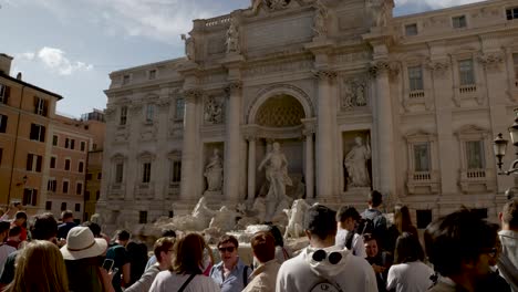 A-cinematic-view-of-peoples-gatherings-in-the-Trevi-Fountain,-Rome-in-the-morning