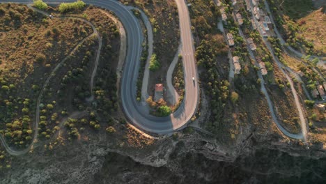 Car-on-hairpin-turn-in-the-Spanish-mountains,-Sierra-Nevada