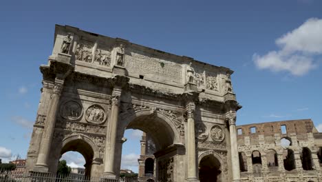 A-cinematic-view-of-the-Arch-of-Constantine-And-The-Colosseum-In-Rome-on-a-sunny-morning