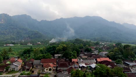 Iconic-Indonesia-village-on-foothill-of-Menoreh-mountain,-aerial-drone-view
