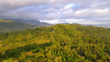 Aerial-view-of-endless-vast-forest-and-hill-with-cloudy-sky