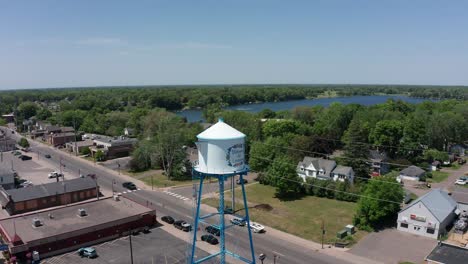 Reverse-pullback-aerial-panning-shot-of-the-Swedish-Coffee-Pot-Water-Tower-in-Lindstrom,-Minnesota