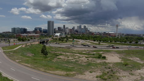 Downtown-Denver-Aerial-Drone-cinematic-125-cars-traffic-South-Platte-River-Elitch-Gardens-Ball-Arena-Union-Station-DU-MSCD-cityscape-Colorado-Nuggets-Avalanche-Broncos-spring-summer-forward-movement