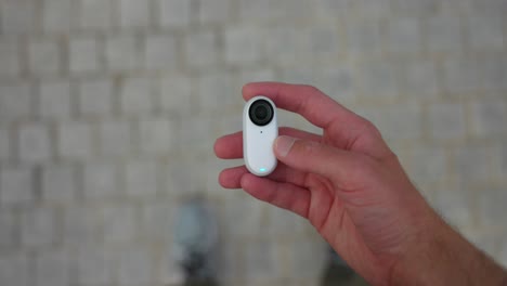 Overhead-View-Of-Insta360-Go-3-In-Palm-Of-Hand-Showing-Size-Comparison