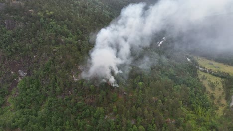 Burning-forest-after-lightning-strike-in-Stamneshella-Vaksdal-municipality-Norway---Aerial-above-recently-started-fire