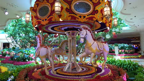 Colorful-Floral-Horses-Carousel-Rotating-Inside-Wynn-Hotel,-Las-Vegas