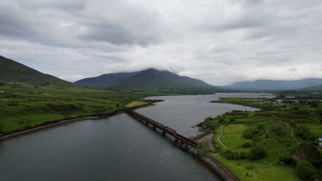 Valentia-River-Viaduct-under-cloudy-dramatic-sky-in-Cahersiveen,-Ireland