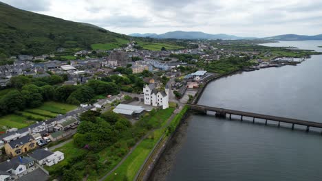 Aerial-dolly-forward-drone-shot-of-Caherciveen-from-Valentia-River,-Ireland