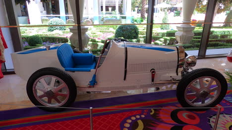 Old-Classic-Rare-Convertible-White-Car,-Side-View,-Indoor-Exhibition