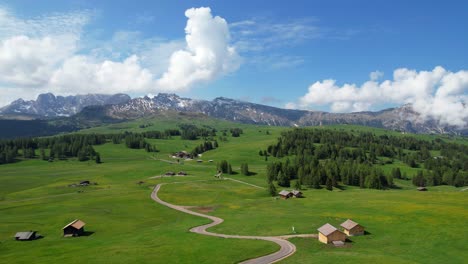 4K-Aerial-landscape-of-vast-green-Alpe-di-Siusi-Dolomite-plateau,-Dolomiti-National-Park,-Italy