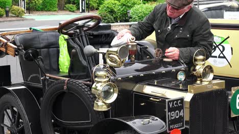 1904-vintage-car-been-topped-up-with-oil-at-the-Gordon-Bennett-Rally-Carlow-Ireland