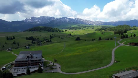 Drone-flying-over-Alpe-di-Siusi-valley-in-Dolomiti-National-Park,-Italy