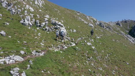 Group-of-kids-hiking-up-a-mountain-ledge