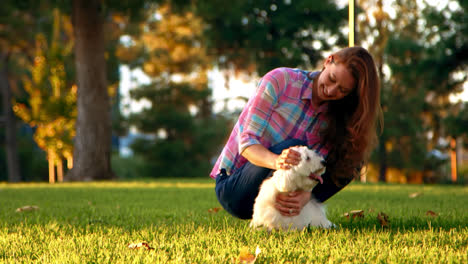Woman-Petting-White-Dog-at-Park-Proud