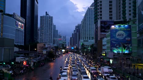 Heavy-Traffic-On-The-Road-In-Bangkok,-Thailand-During-Rush-Hour-At-Dusk---high-angle-shot