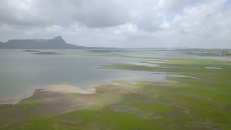 Overflowing-Rivers-And-Flooded-Vast-Green-Landscape-Caused-By-Heavy-Monsoon-Rains-In-Trimbakeshwar,-India---Pan-Wide-Shot