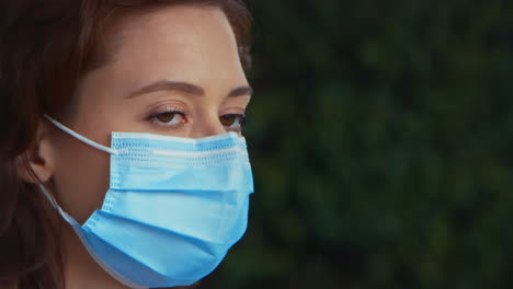 [Camera-Used:-Canon-C300]-Close-up-caucasian-woman-wearing-a-surgical-face-mask