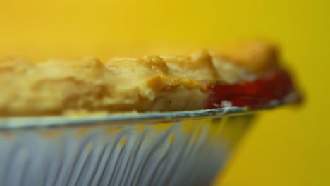 [Camera-Used:-Canon-C300]-Macro-Rack-Focus:-rotating-cherry-pie-crust-with-cherries-oozing-out-the-sides