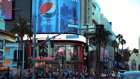 HIGHLAND-AT-HOLLWOOD-BLVD-INTERSECTION,-PEOPLE-CROSSING