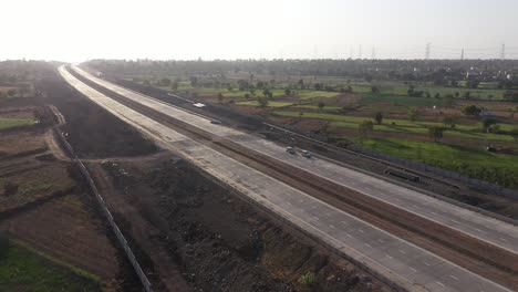Excavated-Land-For-Pipeline-Work-On-Side-Of-Newly-Build-Expressway-Passing-By-Rural-Fields