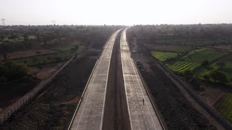 Flying-Over-An-Excavated-Roadside-For-Pipeline-Installation-With-View-Of-Greenery-Landscape