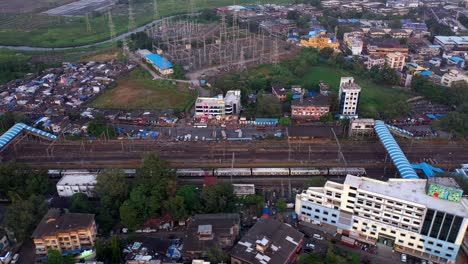 Suburban-Railway-Lines-In-Vasai,-Mumbai-India---aerial-drone-shot