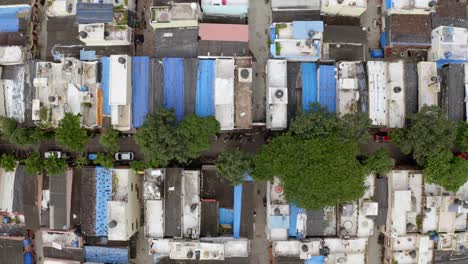 Top-down-view-of-buildings-and-streets-in-the-suburban-area-of-Mumbai-in-India---aerial-drone-shot
