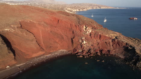 Drone-Shot-of-Red-Beach-and-Coastline-of-Santorini-Island,-Greece