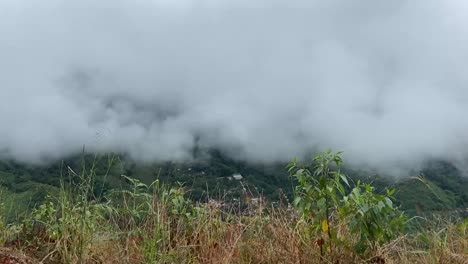 Hillside-Village-And-Forest-With-White-Clouds-From-Traveling-Car-In-Meghalaya,-India