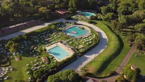 Tilt-Down-Shot-Of-Beautiful-Swimming-Pools-In-Amigos-Club-Resort,-Buenos-Aires,-Argentina