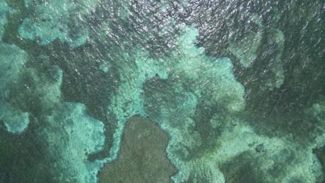 Aerial-View-Of-Ocean-With-Calm-And-Clear-Water-During-Summer