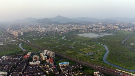 Cityscape-of-Suburban-Vasai-near-Mumbai,-India-on-a-Cloudy-Day---aerial-panoramic