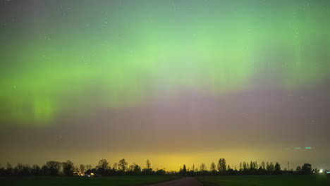 Scenic-View-Of-Northern-Lights-Over-Rural-Landscape